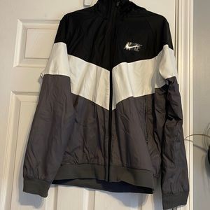 Black, Grey, and white Nike jacket